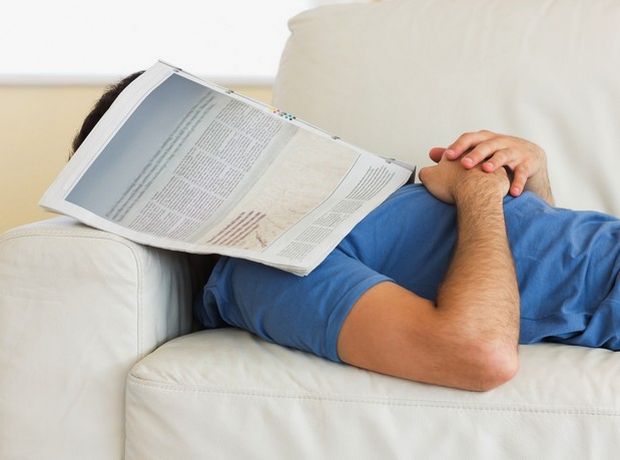 man-lying-on-couch